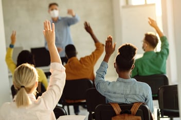 workers in a learning setting, answering questions. 