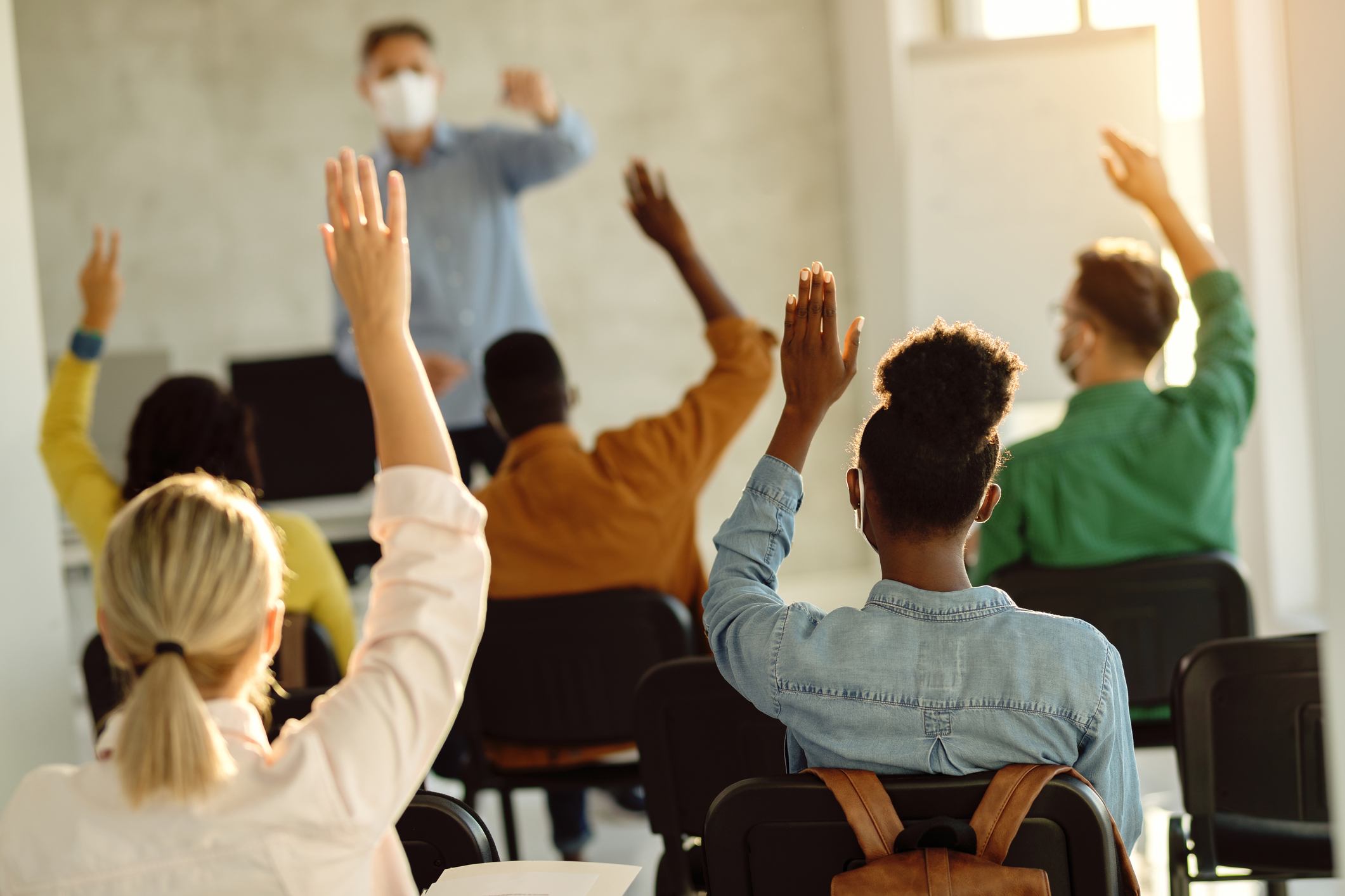 workers in a learning setting, answering questions. 